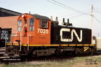 7025b