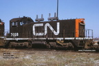 7028b
